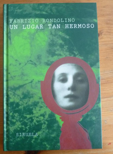 Portada del libro de UN LUGAR TAN HERMOSO. FABRIZIO RONDOLINO. ED SIRUELA. 1997 187 PAG