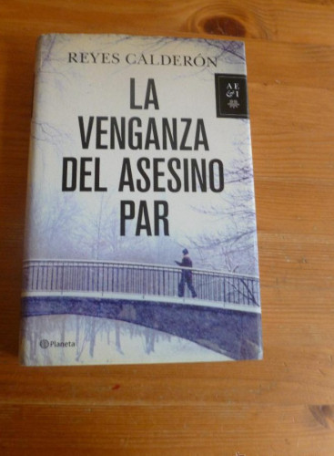 Portada del libro de LA VENGANZA DEL ASESINO PAR. REYES CALDERON. PLANETA. 2012 447 PAG