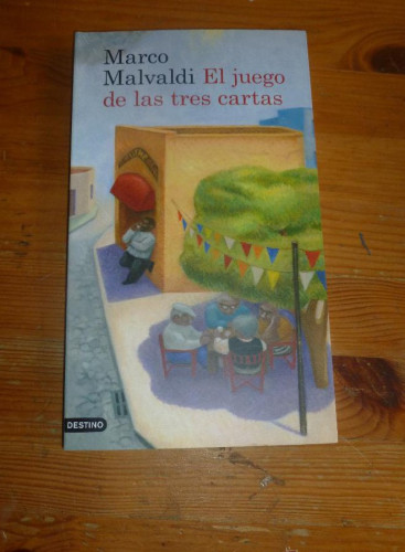 Portada del libro de El juego de las tres cartas (Áncora & Delfin)