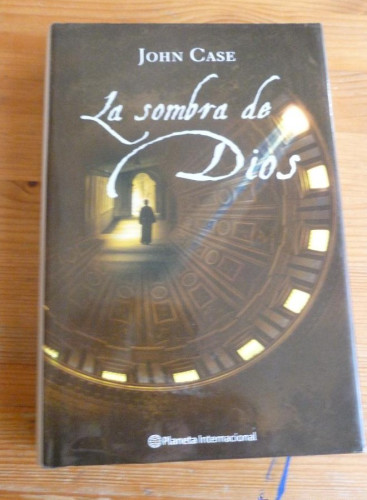 Portada del libro de LA SOMBRA DE DIOS. JOHN CASE . PLANETA INTERNACIONAL. 2006 418 pp